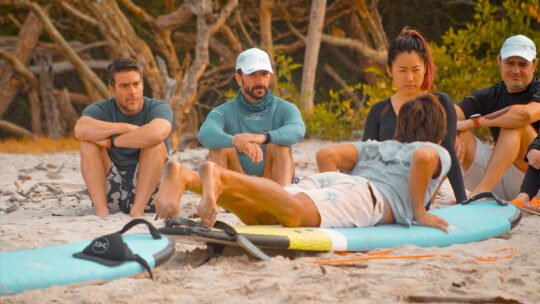 Group of friends listening to WildMex instructor during land lesson at La Lancha