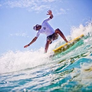 Surfer catching waves