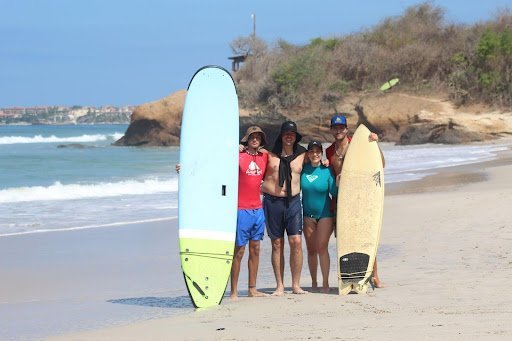 Family enjoying surf lessons at one of the best family surf camps