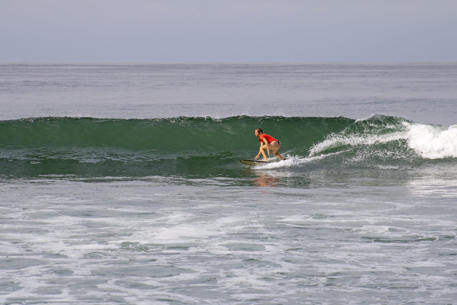 Experience the connection between nature and surf at Punta de Mita’s iconic break Surfer riding a clean wave at Burros, Punta de Mita with confidence and flow