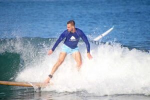 Surfer riding a wave in Sayulita during professional surf photography session