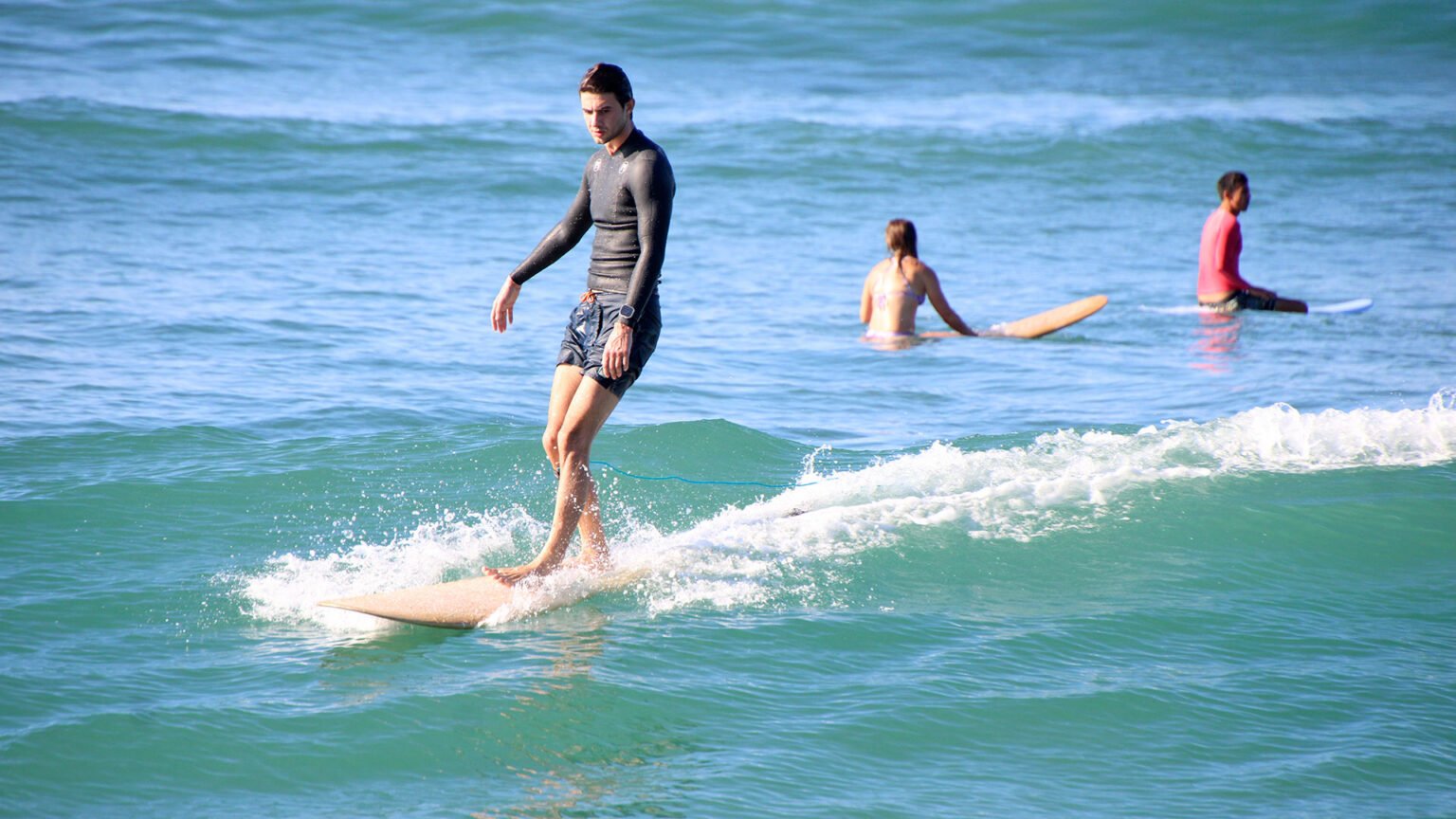 Surfer riding a wave during WildMex surf camp in Punta Mita