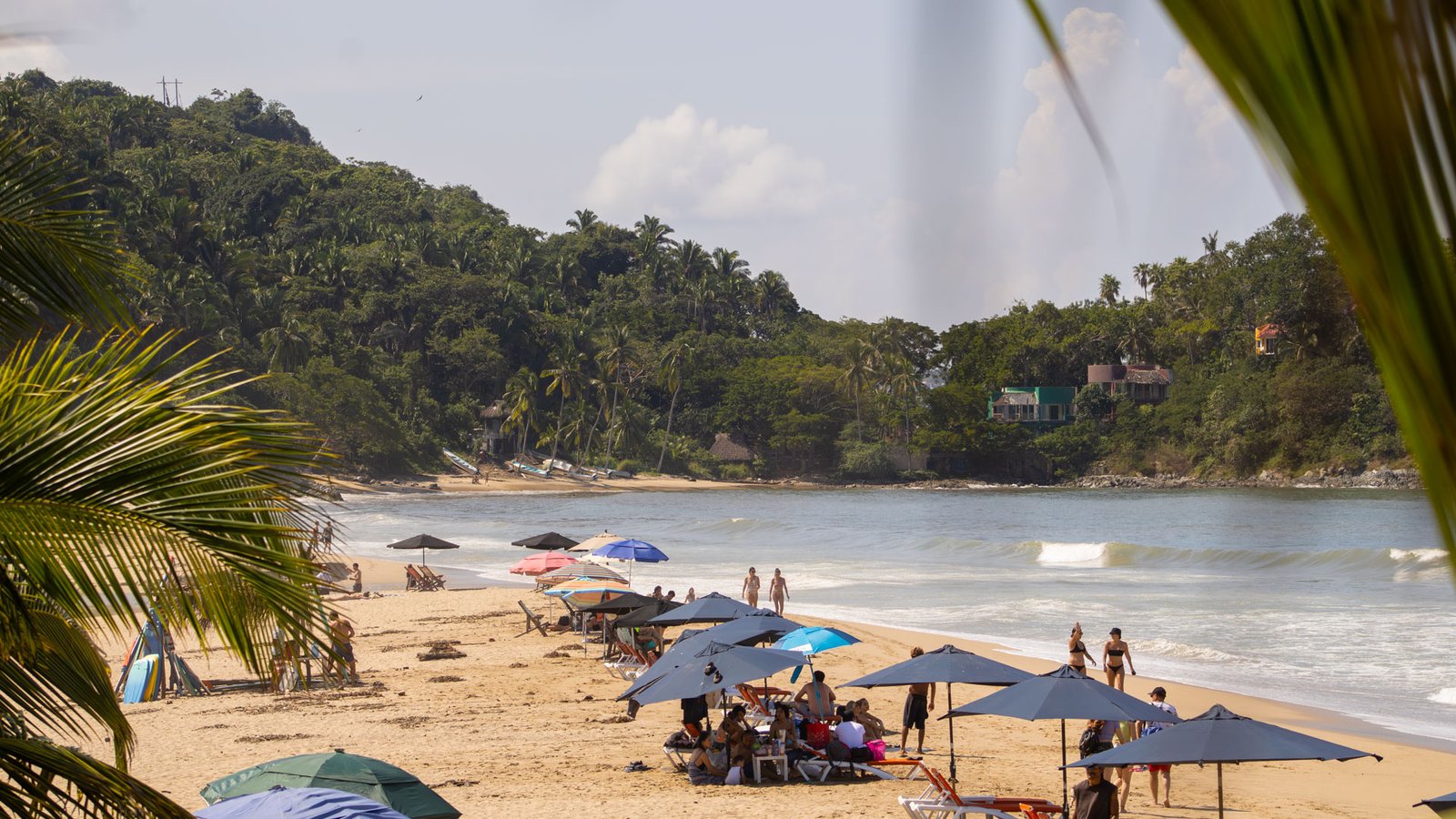 San Pancho beach with visitors enjoying the day